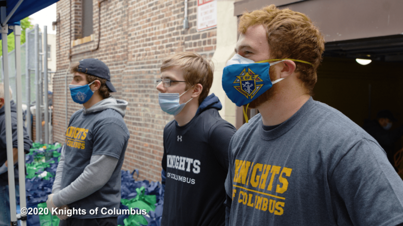 Knights praying at food drive