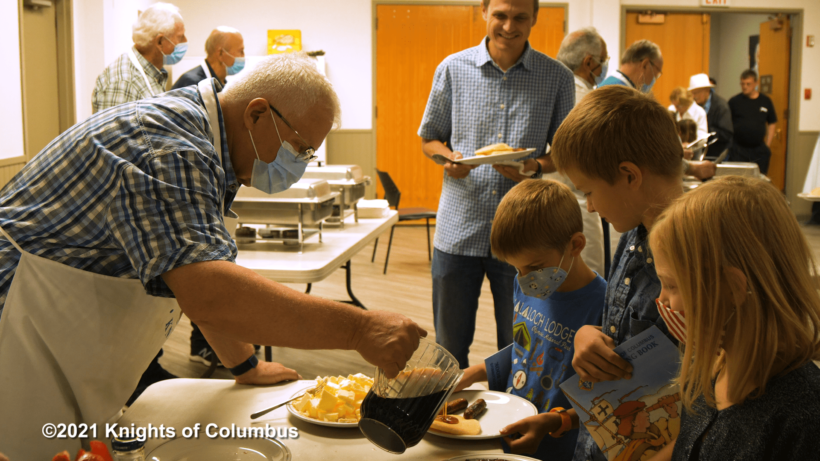 Alberta Knights serving food to parishioners